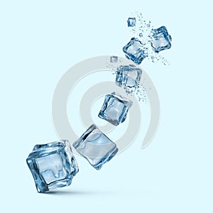 Ice cubes with water splashes isolated on blue background