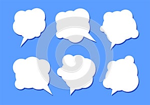 Set of six white speech bubbles with shadow on a blue background