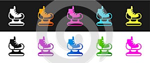 Set Skates icon isolated on black and white background. Ice skate shoes icon. Sport boots with blades. Vector