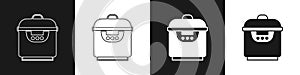 Set Slow cooker icon isolated on black and white background. Electric pan. Vector