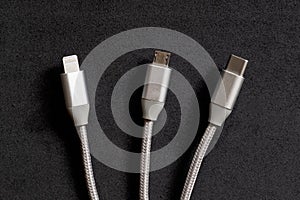 Set of smartphone connectors: lightning, micro-usb and type-c cables