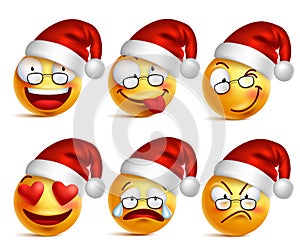 Set of Smiley face of santa claus yellow emoticons with facial expressions and christmas hat photo