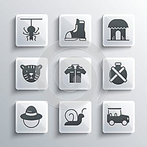 Set Snail, Safari car, Canteen water bottle, Shirt, Camping hat, Tiger head, Spider and African hut icon. Vector