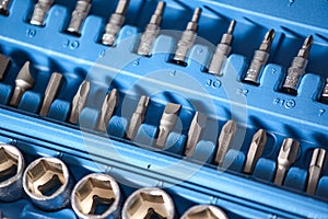Set of socket wrench and drivers in plastic box closeup