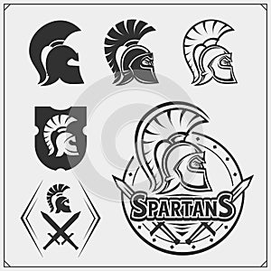 Set of spartans emblems and labels. Sport club design elements and templates. Ancient warriors, spartan spirit, gladiator helmets.