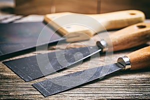 Set of spatulas on wooden background