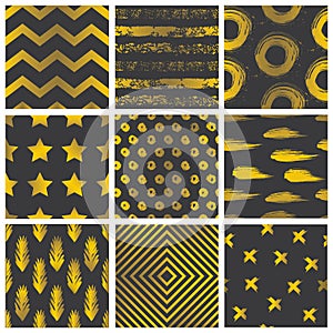 Set of spectacular patterns with gold hand drawn elements on black background. photo