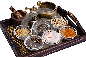 Set of spices and seeds of legumes in glass molds on tray