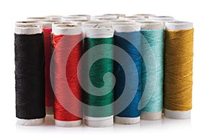 Set of spools with multicolored threads isolated on white background