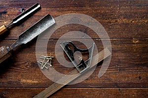 Set square and chisels, flat lay, overhead