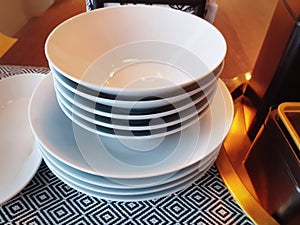 Set of Stacked White Bowls on Table