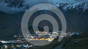 Set. Stepantsminda, Georgia. Countryside Landscape In Kazbegi District, Georgia. Night Starry Sky With Glowing Stars