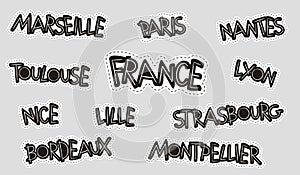 A set of stickers with the names of French cities