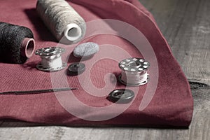 Set of stitching tools on red cloth