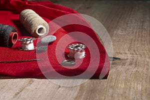 Set of stitching tools on red cloth