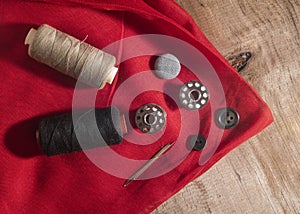 Set of stitching tools on red cloth