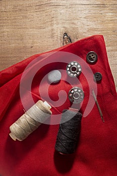 Set of stitching tools on red cloth