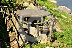 Set of stone table and chairs in the garden.