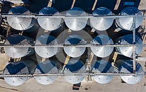 Set of storage tanks raw material agricultural crops feed mills. Aerial vew from drone photo