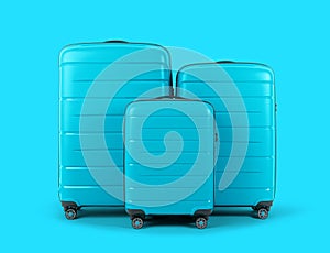 Set of stylish blue plastic suitcases for travel on blue background.
