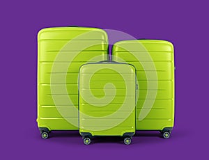 Set of stylish green suitcases for travel on purple background.