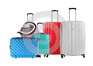 Set of stylish suitcases for travelling on white background