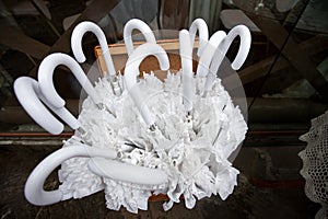 A set of stylish white wedding umbrellas on a rainy day for holiday guests.
