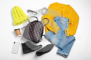 Set of stylish winter clothes on white, top view