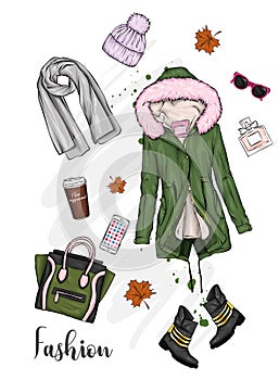 A set of stylish women`s clothing and accessories. Jacket, coat, shoes, bag, shoes, hat, glass of coffee and perfume. Autumn.