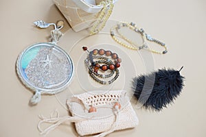 Set of subjects with gemstone bracelets  knitted bag and black feather