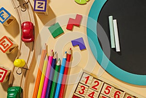 Set of supplies for mathematics and for school. Fractions, rulers, pencils, notepad on beige background. Back to school,