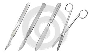 A set of surgical cutting tools. Reusable all-metal scalpel, delicate pointed scalpel with removable blade, amputation photo