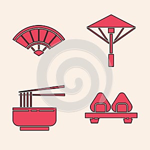 Set Sushi on cutting board, Paper chinese or japanese folding fan, Japanese umbrella from the sun and Asian noodles in