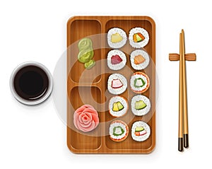 Set sushi rolls with various ingredient on wooden tray. Fast-food collection