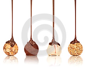 Set of sweets poured melted chocolate on a white background