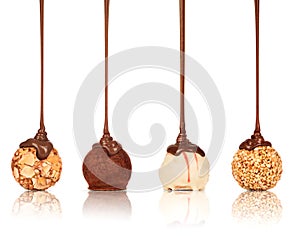 Set of sweets poured melted chocolate on a white background photo