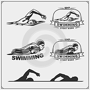 Set of swimming emblems, labels and design elements.