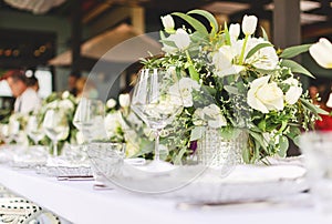 Set table for a white and aqua blue wedding dinner decorated