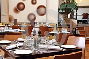 Set tables in restaurant, decorative in brownish colors