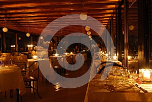 Set tables of a restaurant by candlelight