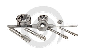 Set of taps and dies for threading on a white background