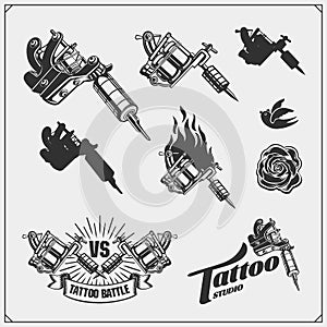 Set of tattoo salon labels, badges and design elements. Tattoo studio emblems with professional equipment.
