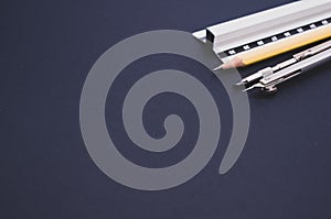 Set of technical drawing tool on a blue background with a copy space