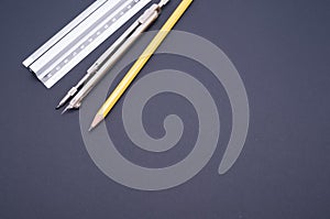 Set of technical drawing tool on a blue background with a copy space