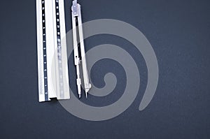 Set of technical drawing tool on a blue background with a copy space