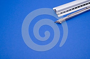 Set of technical drawing tools on a blue background with a copy space