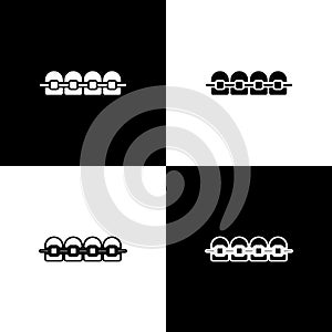 Set Teeth with braces icon isolated on black and white background. Alignment of bite of teeth, dental row with with
