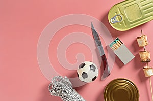 Set of things for survival in journey on pink background. Boy scout concept. Top view