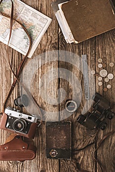 Set of things for travel on the wooden background top view