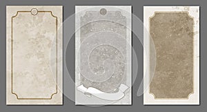 Set of three aged frames of stained and battered blank tarot or playing cards